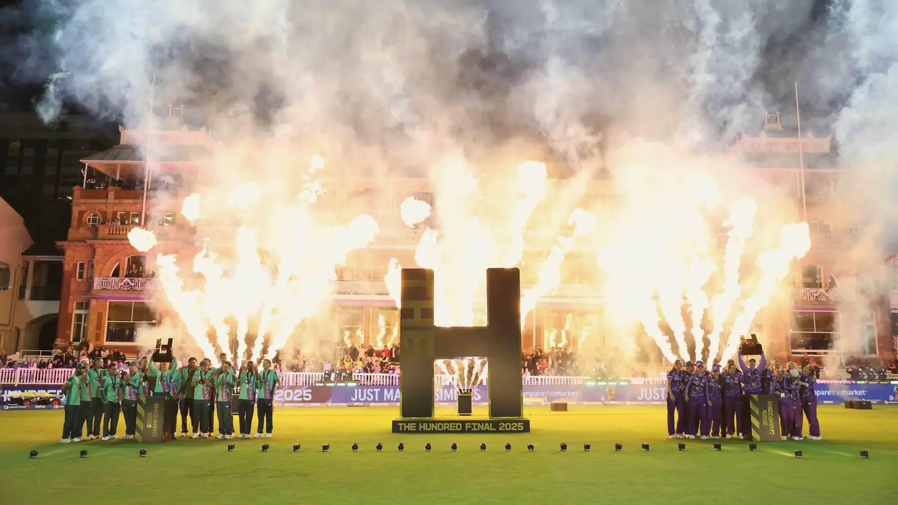 Players lined up as fireworks go off at a Hundred match